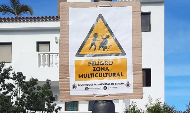 Racist anti-migrant signs cause uproar in Spanish tourist town